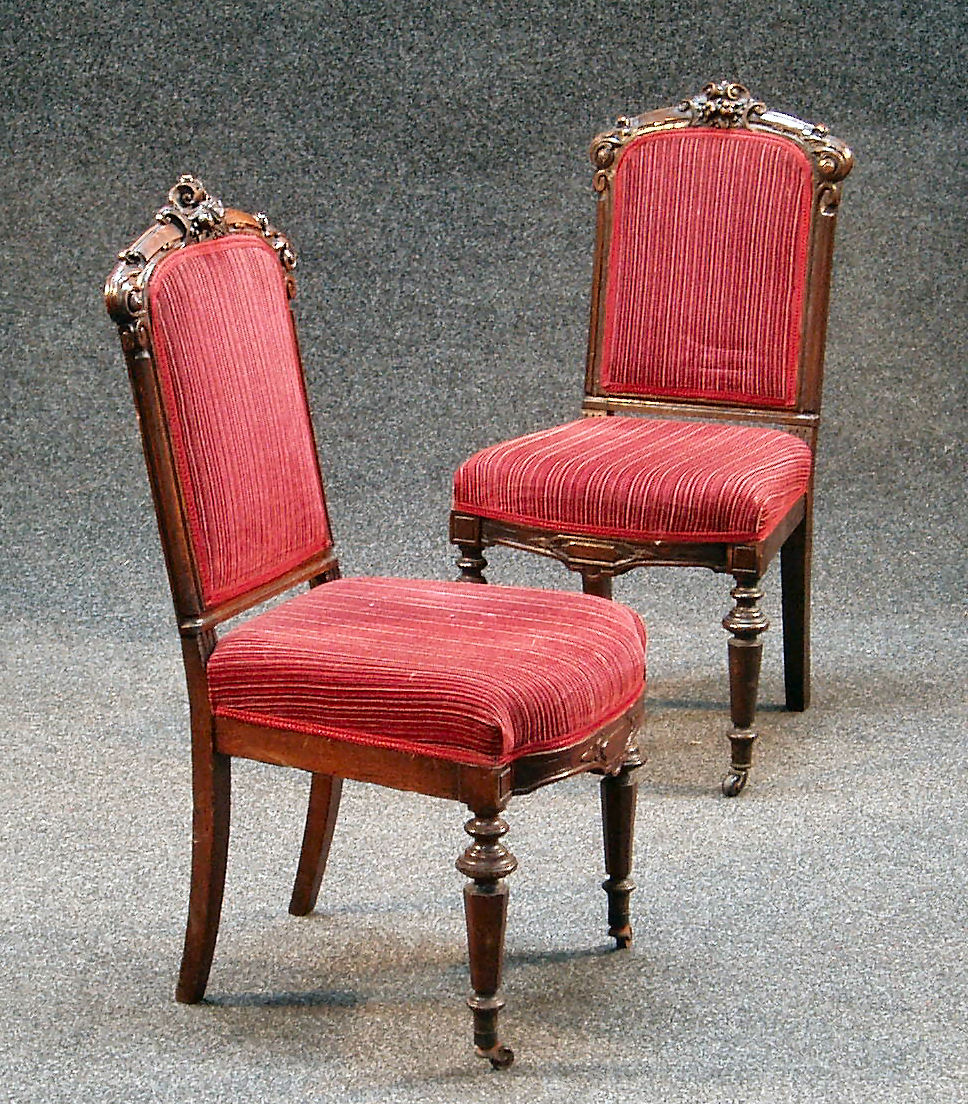A set of six late Victorian oak dining chairs,