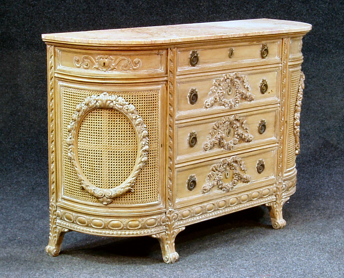 A French style D-shaped marble topped limed oak commode