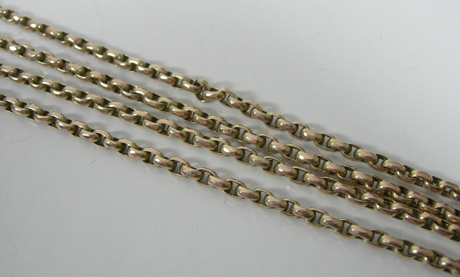 An Edwardian 9ct gold long chain,