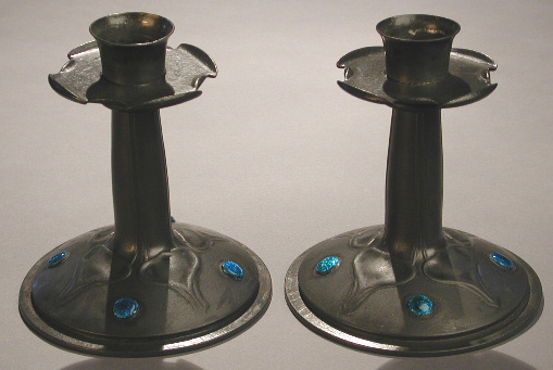 A pair of Tudric candlesticks