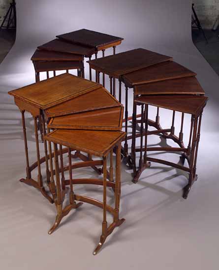 An Edwardian nest of four mahogany tables