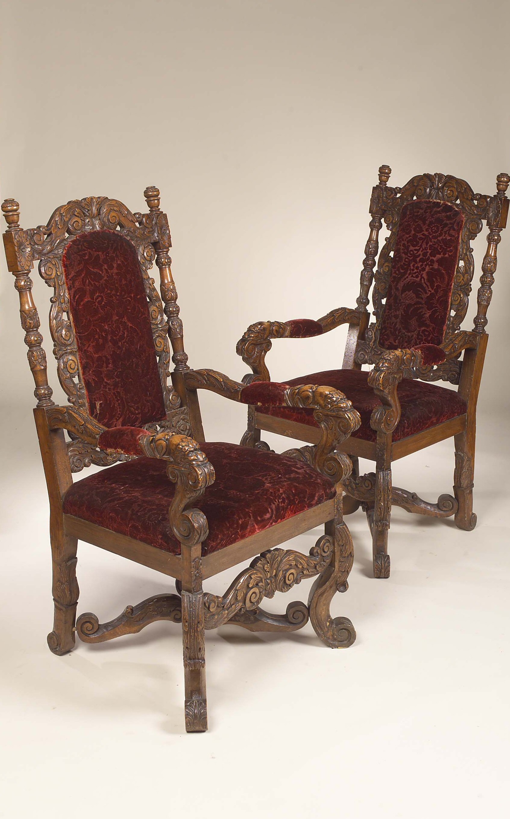 A pair of Victorian walnut open armchairs,