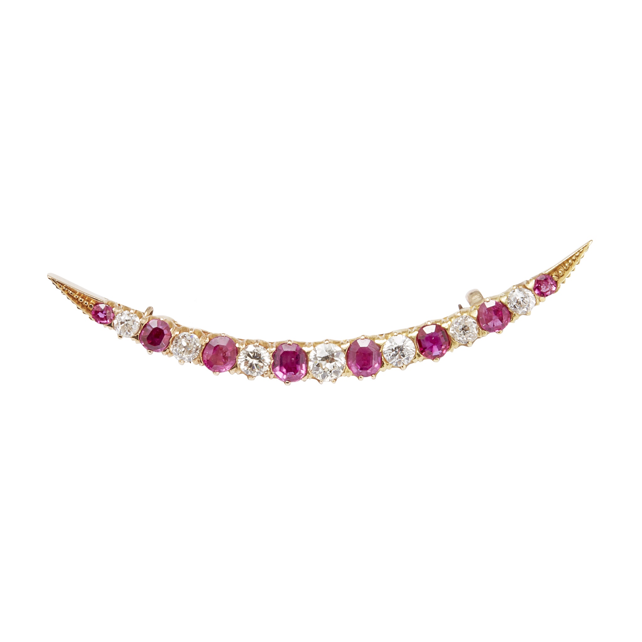 A diamond and ruby set crescent brooch