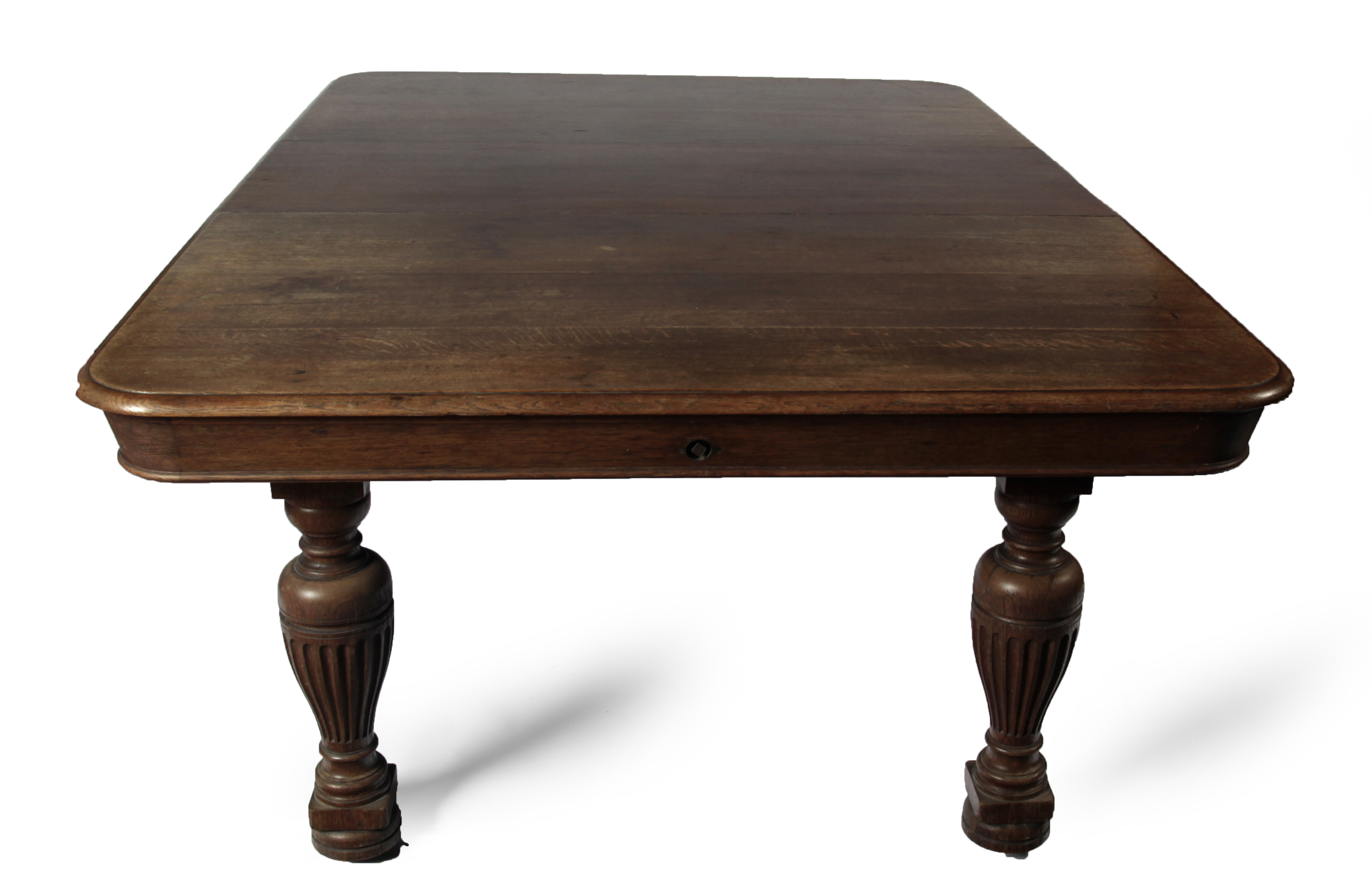 A Victorian oak extending dining table