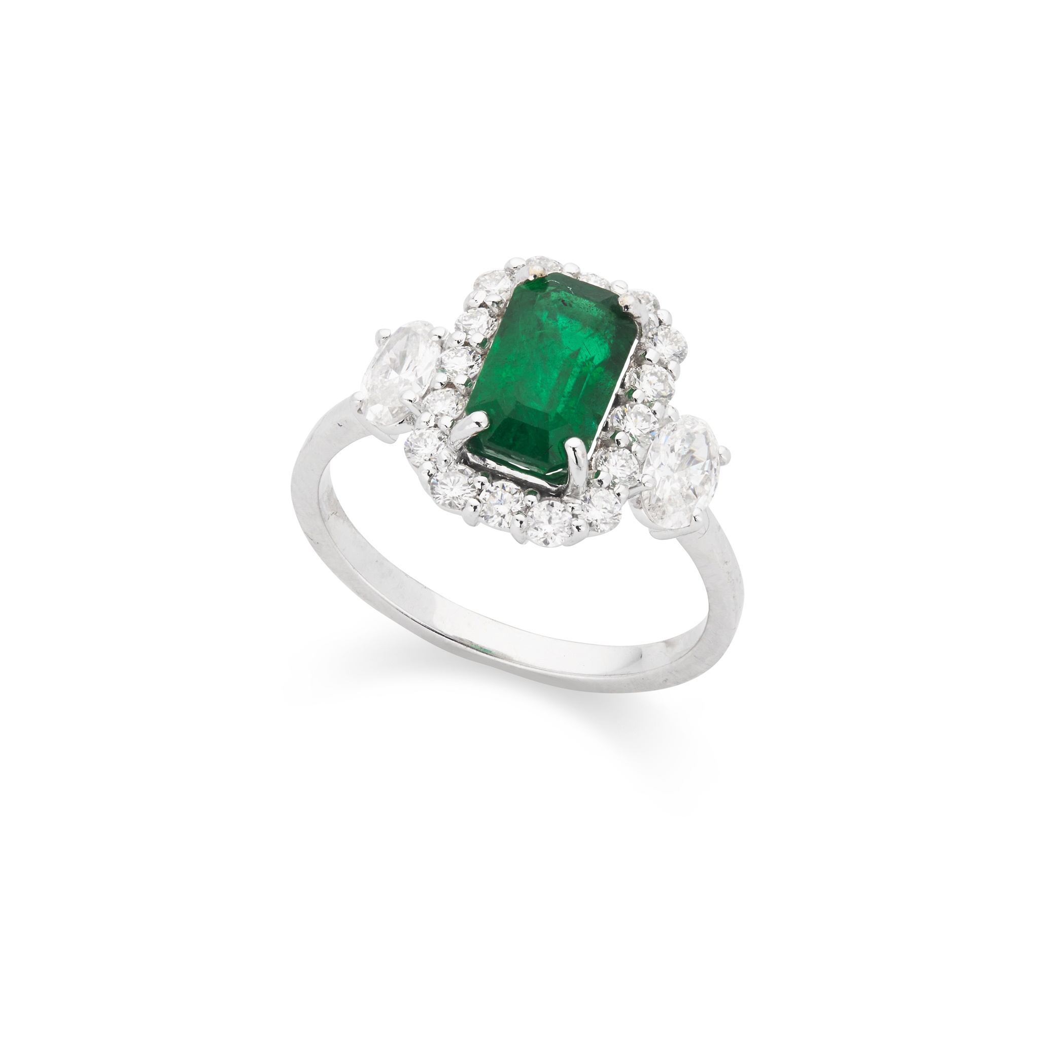 An emerald and diamond ring