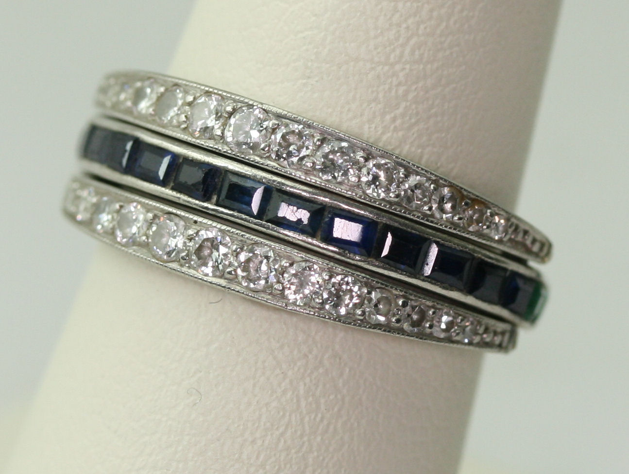 An early 20th century multi-gem set swivelling full-eternity ring