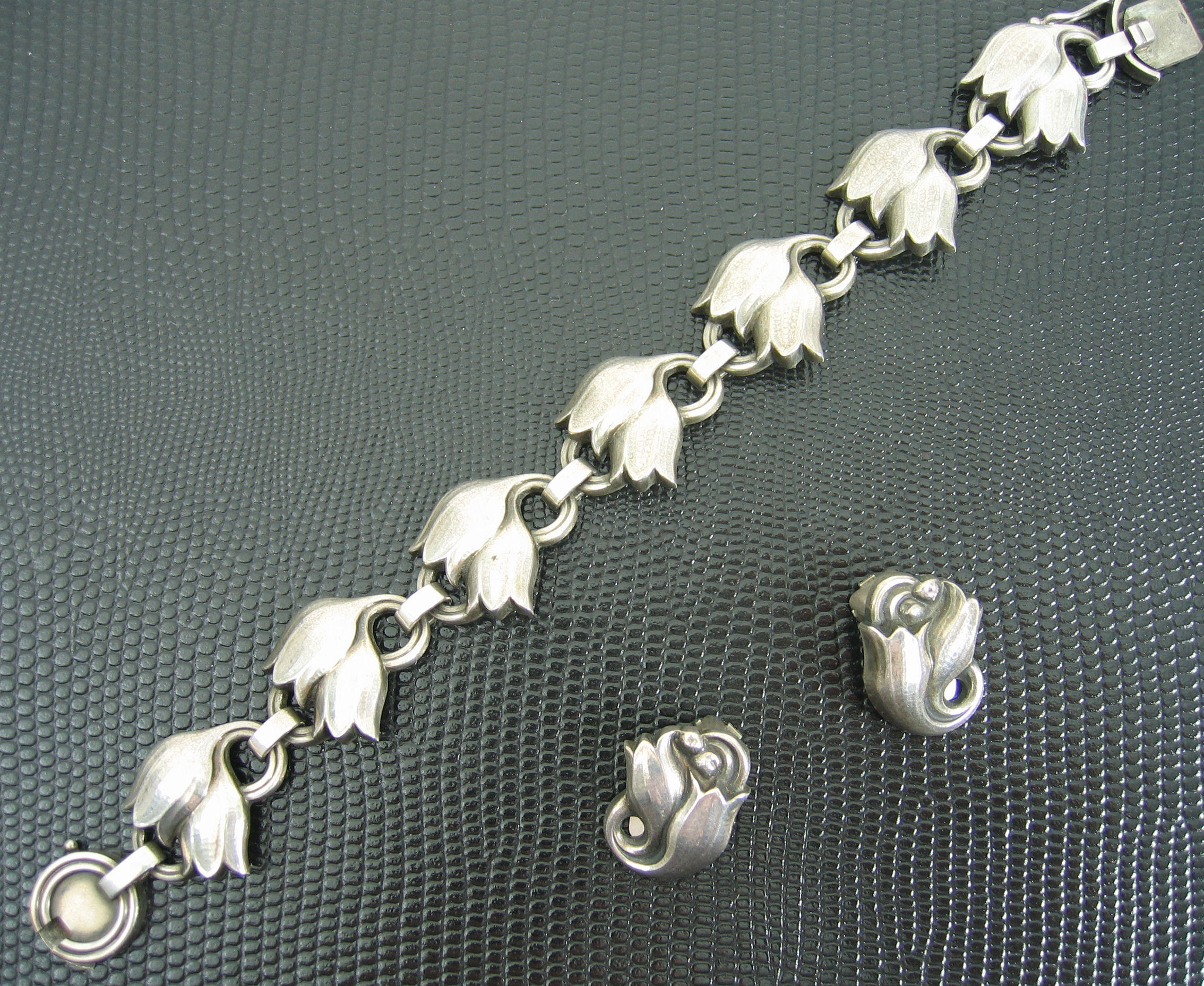 A Georg Jensen sterling bracelet and matching earrings,