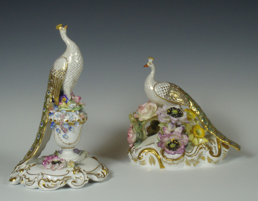 A group of two Royal Crown Derby figures of peacocks