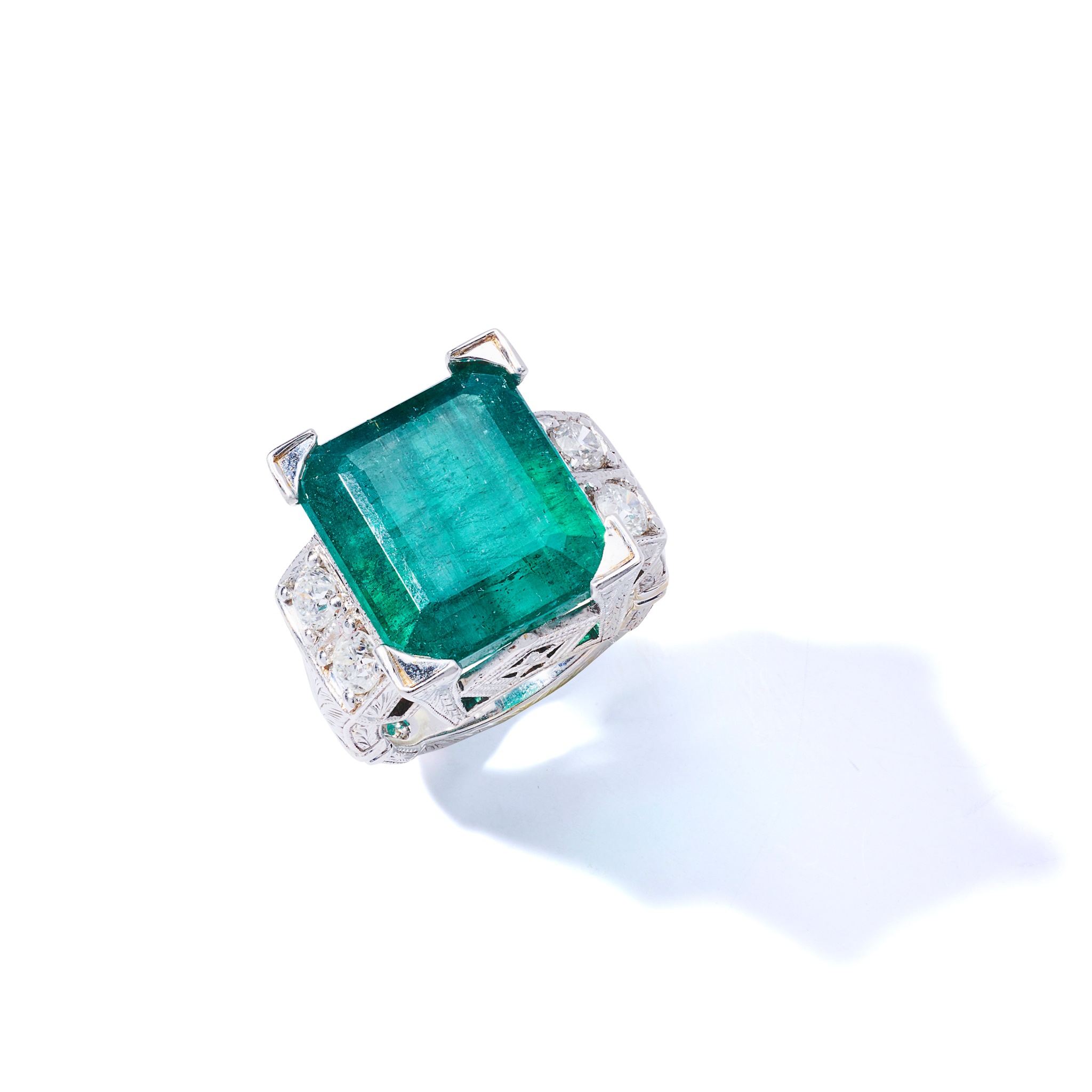 An emerald and diamond dress ring