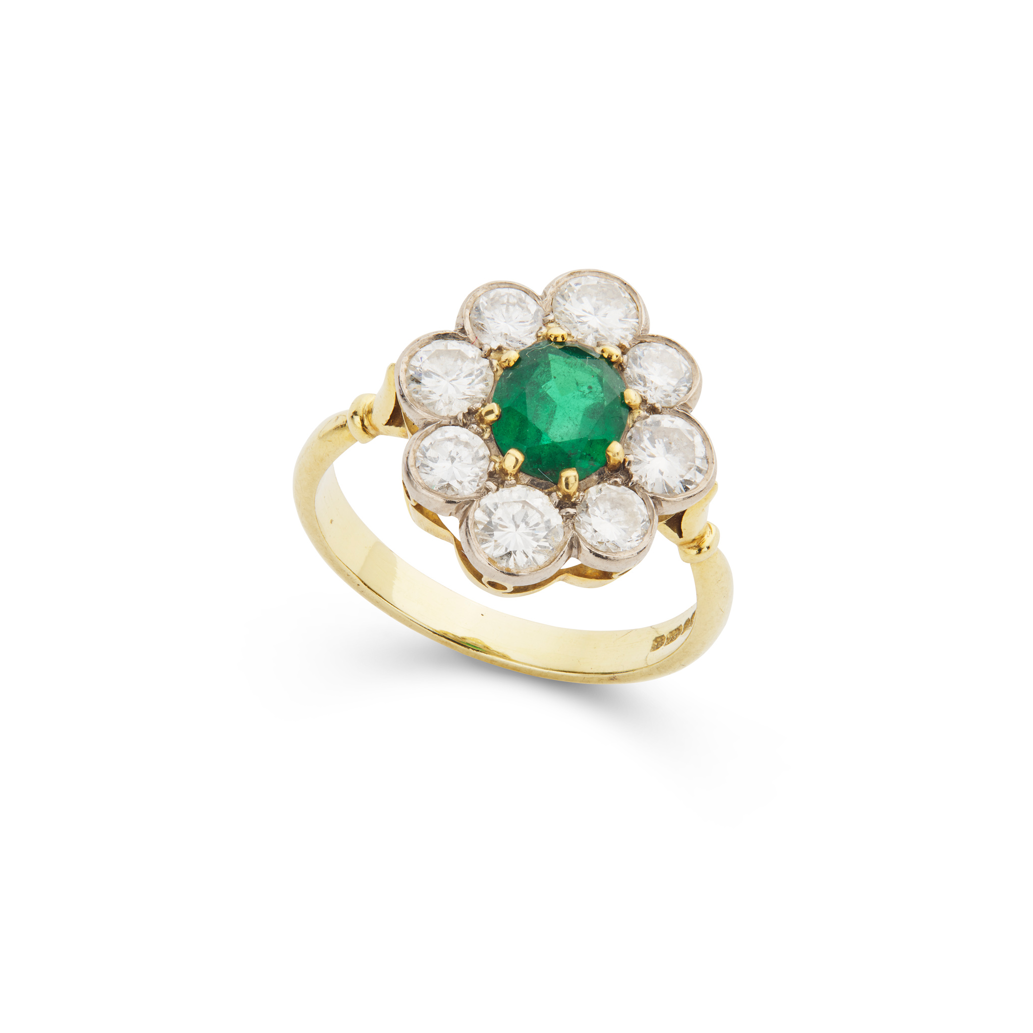 An emerald and diamond cluster ring, 1988