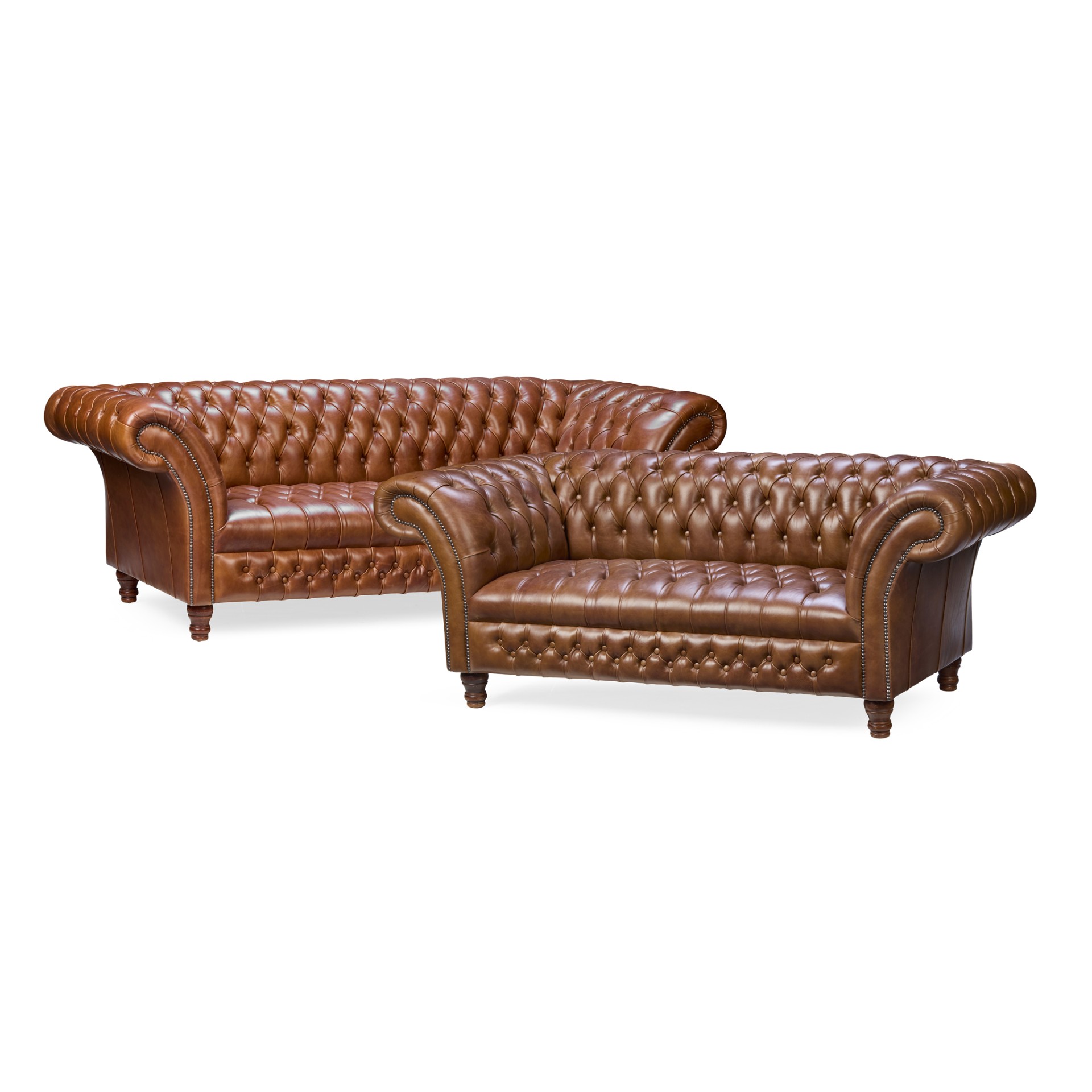 A MATCHED PAIR OF BUTTON-UPHOLSTERED LEATHER CHESTERFIELD SOFAS