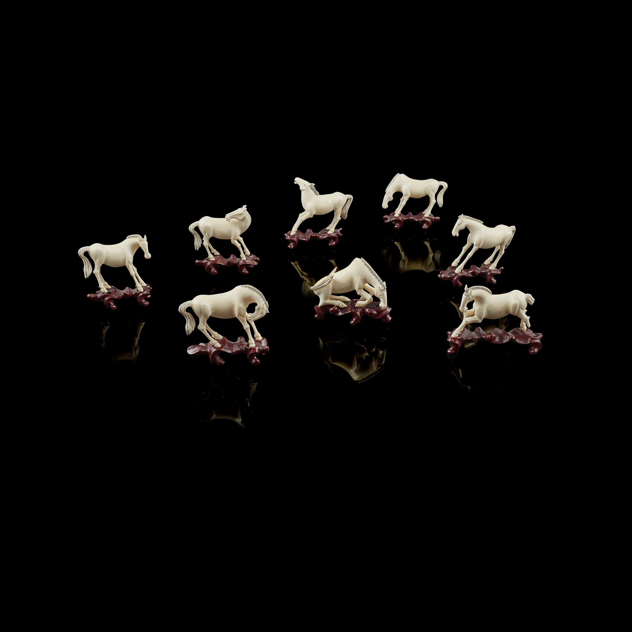 COLLECTION OF EIGHT IVORY HORSES - "HORSES OF MU WANG"