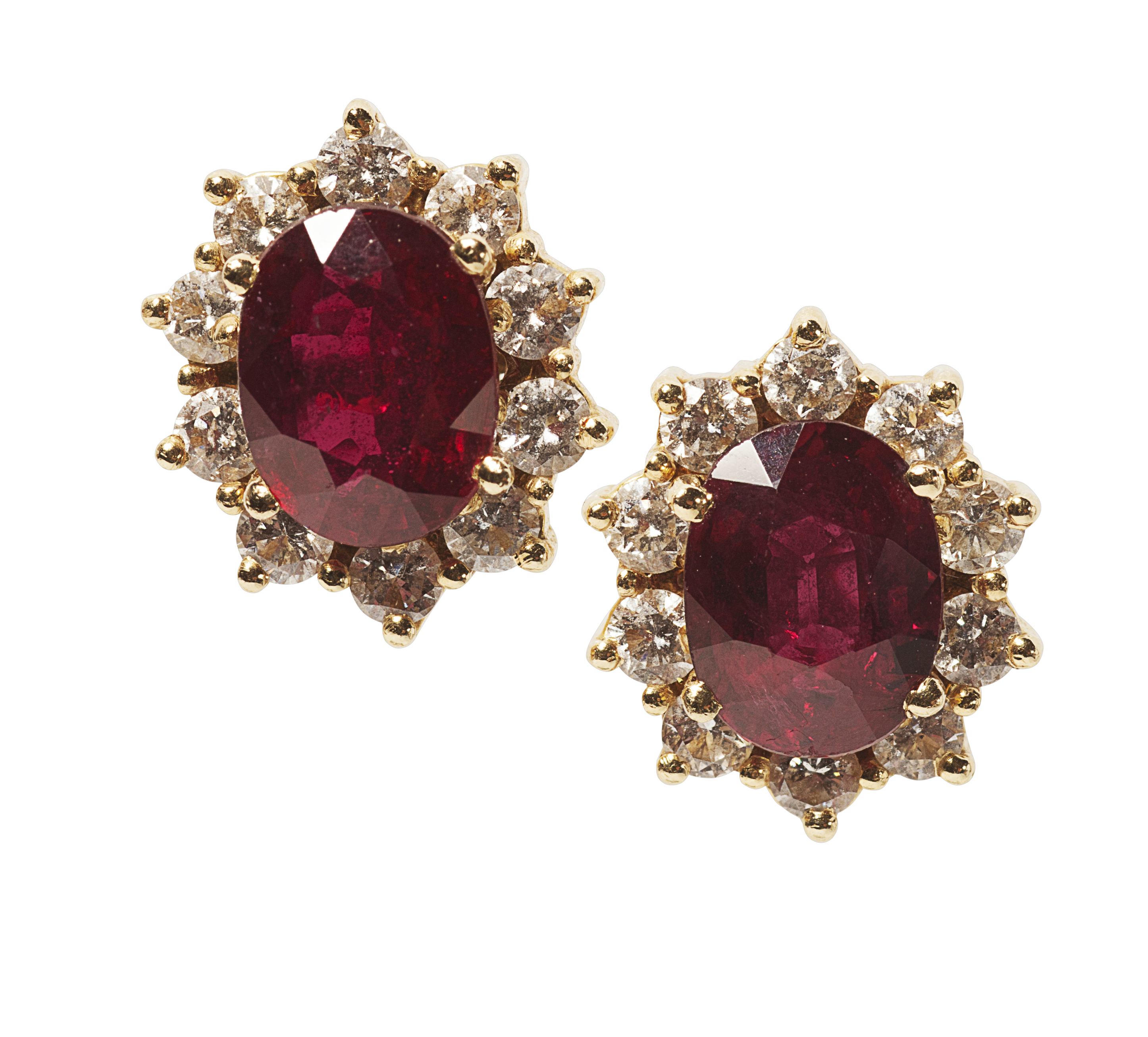 A pair of ruby and diamond set earrings