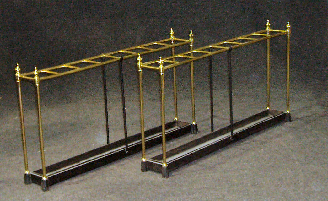 A pair of brass stick stands