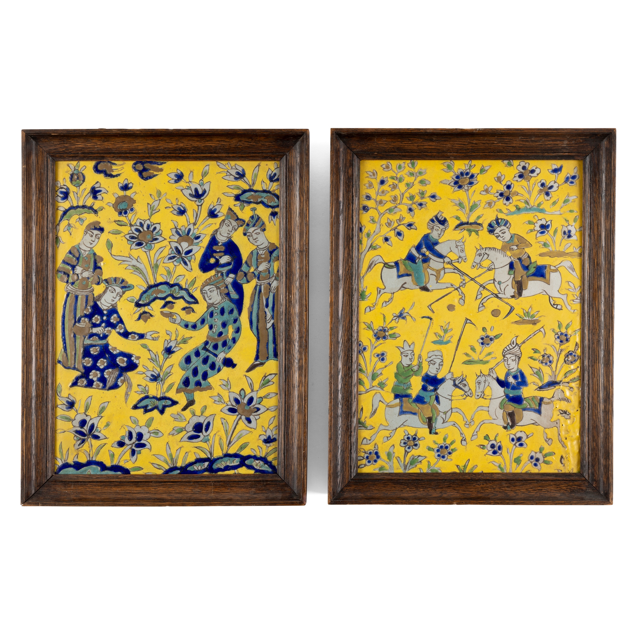 A STRIKING PAIR OF QAJAR CUERDA-SECA POTTERY TILES: COURTIERS IN A GARDEN AND POLO PLAYERS