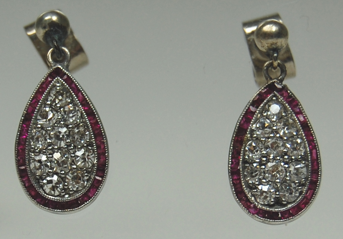 A pair of ruby and diamond pendant earrings,