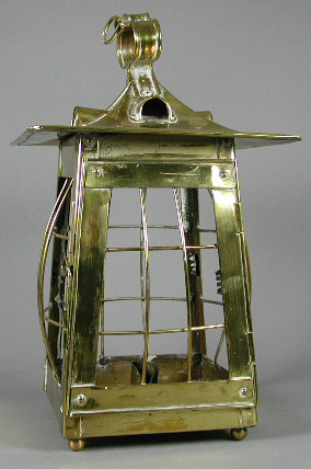 An Arts and Crafts brass hall lantern