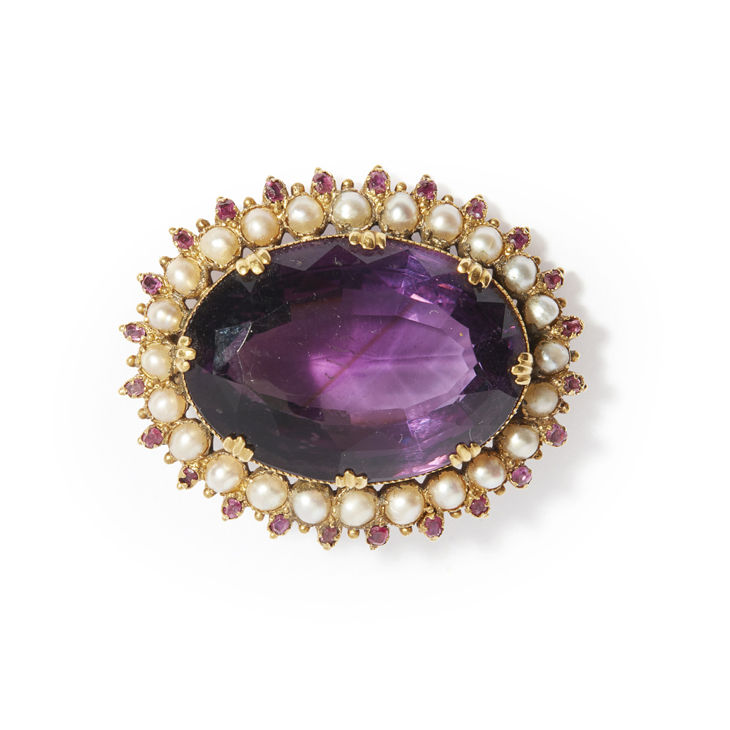 A large amethyst and pearl set brooch