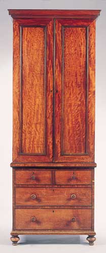An early 19th century mahogany linen press