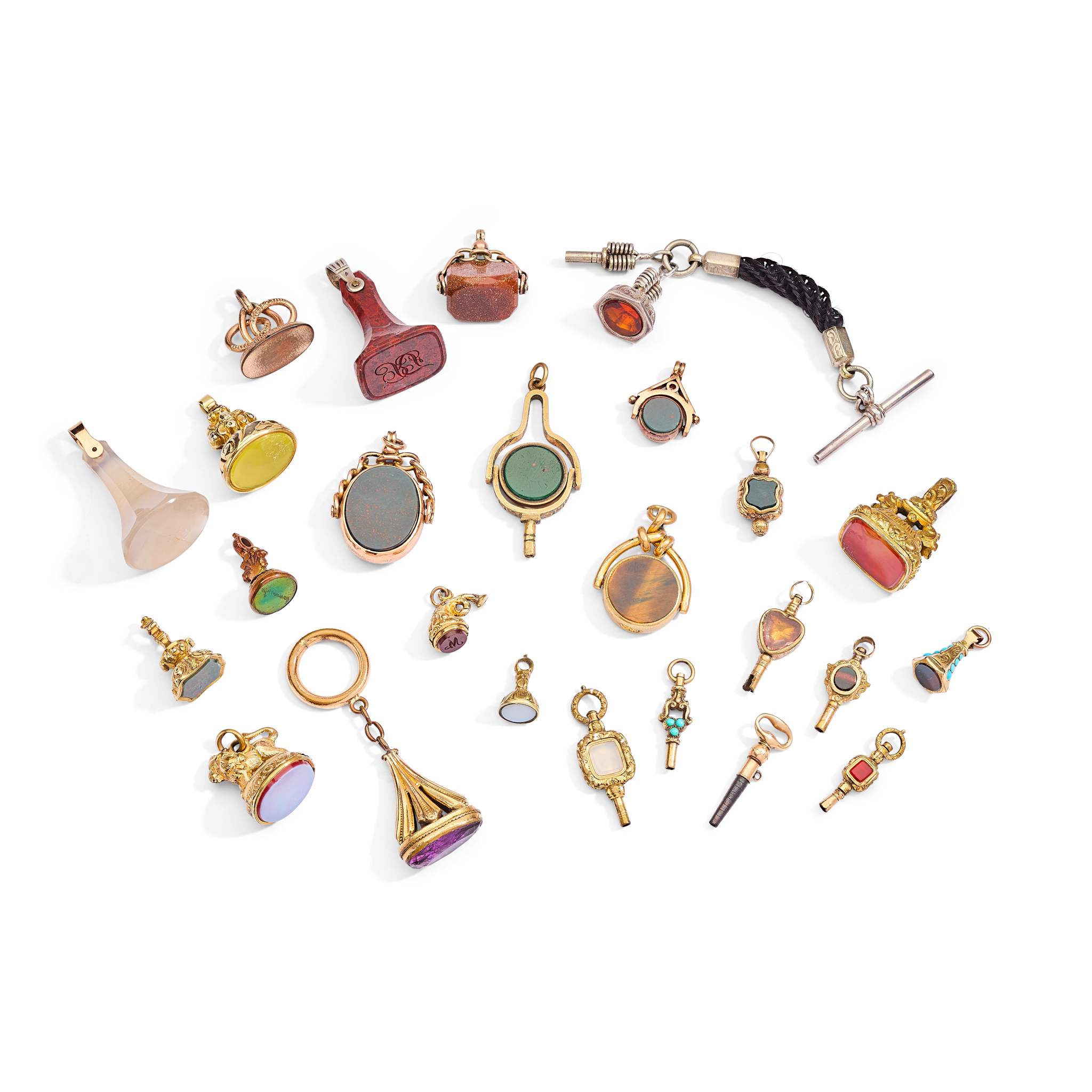 A collection of agate and gemstone set fobs and keys