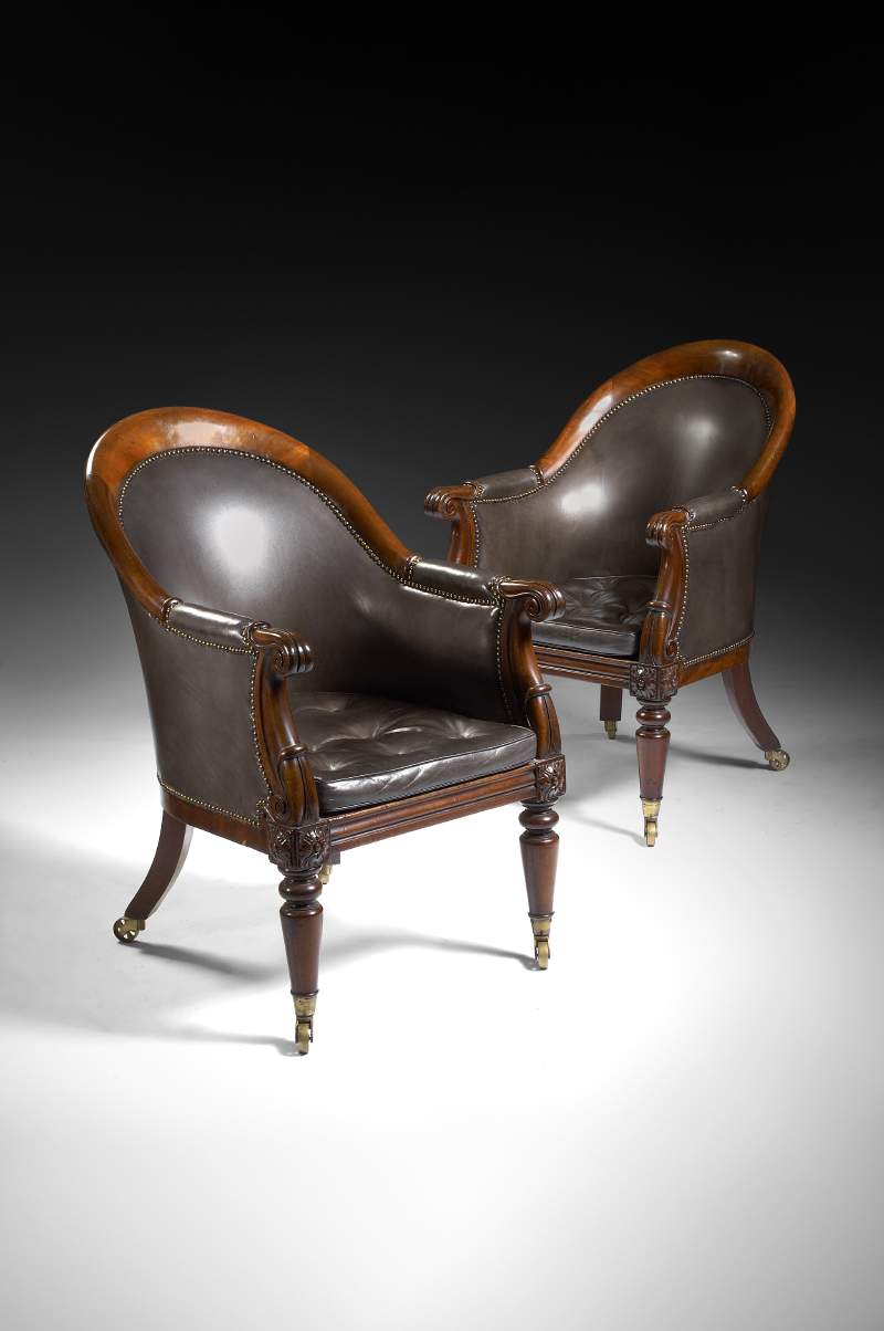 A pair of George IV period mahogany library armchairs