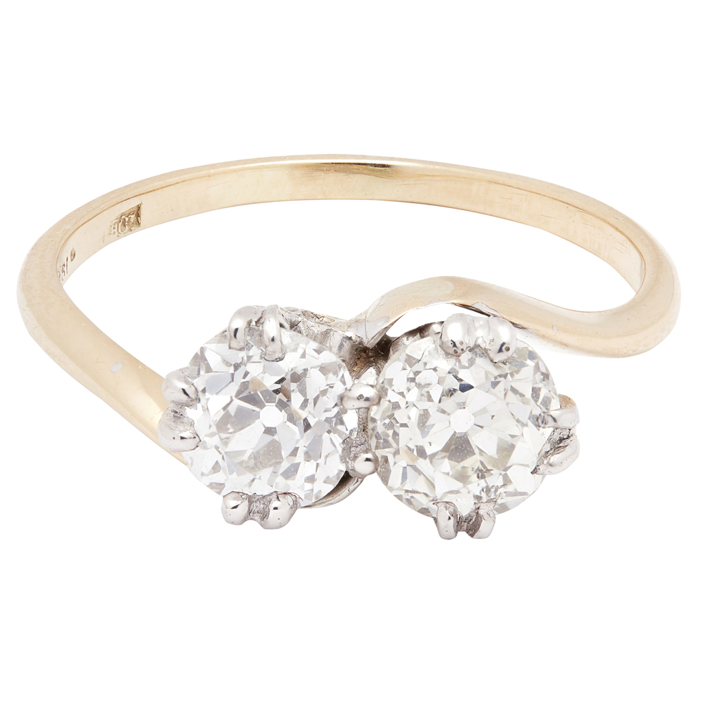 A two stone diamond set twist ring