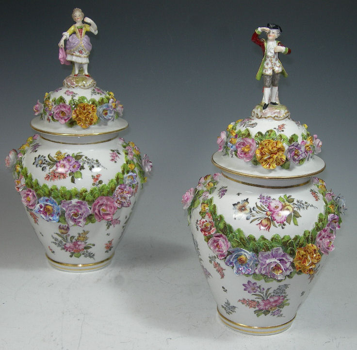A pair of early twentieth century German porcelain jars and covers