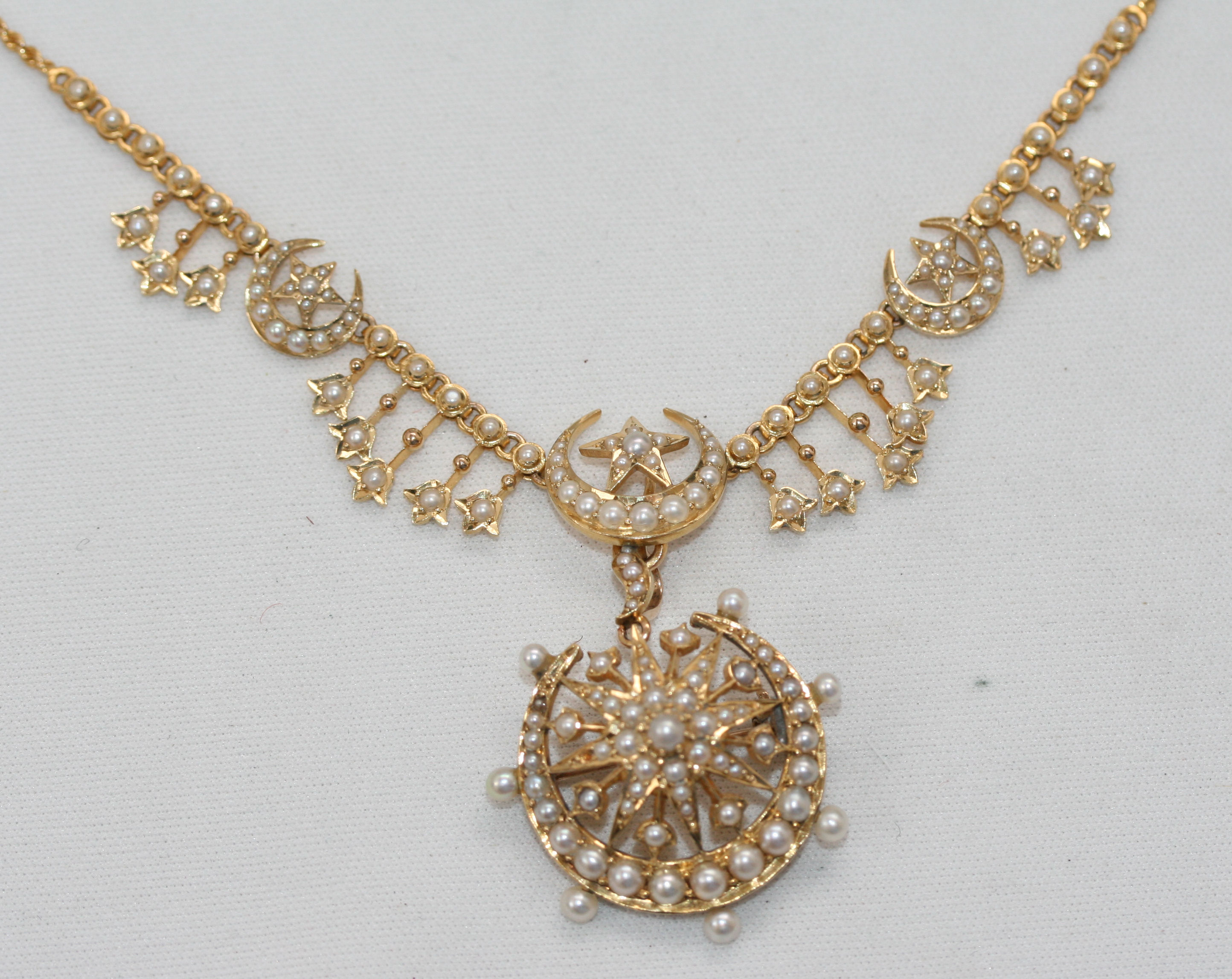 A late Victorian seed pearl set necklace with additional suspension/brooch
