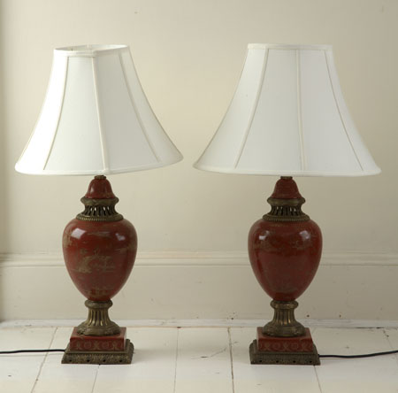 A pair of porcelain and gilt brass lamps