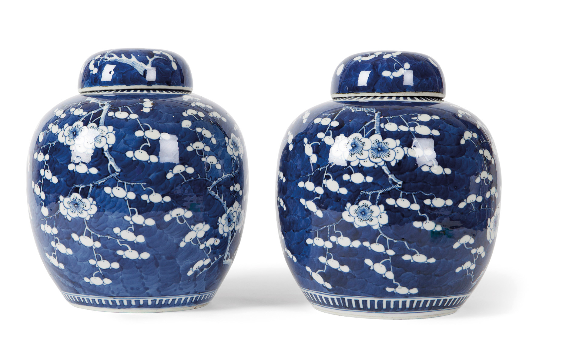PAIR OF CHINESE BLUE AND WHITE 'PRUNUS' COVERED JARS