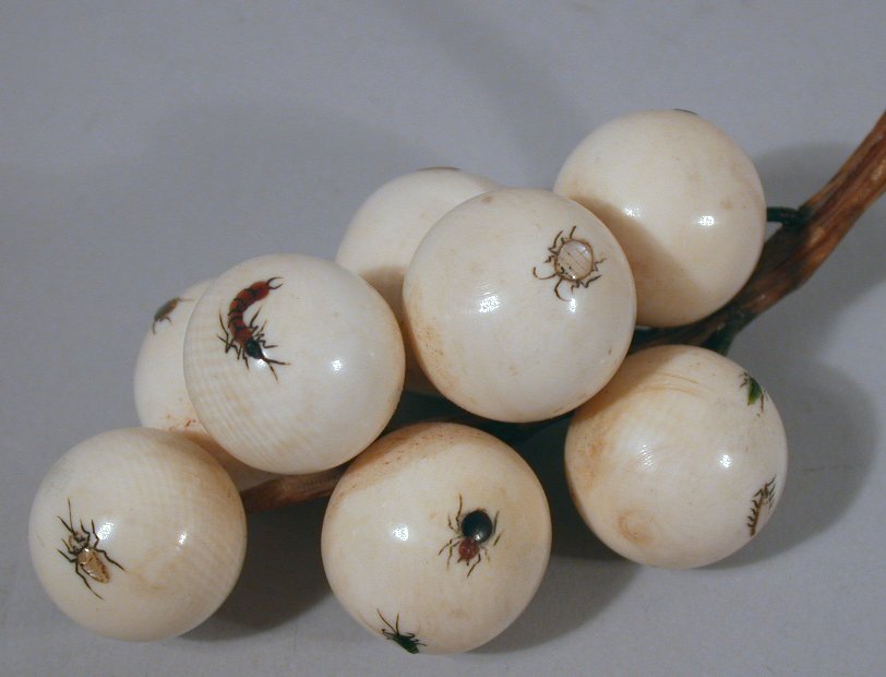 A Japanese carved ivory shibyama decorated bunch of eight cherries