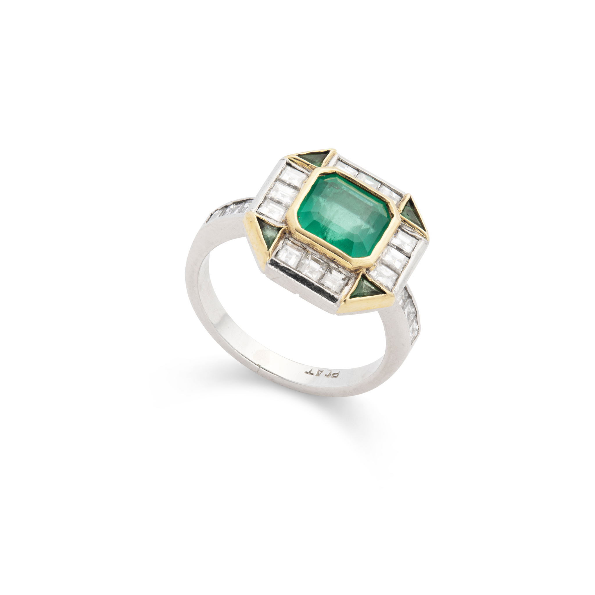 An emerald and diamond cluster ring