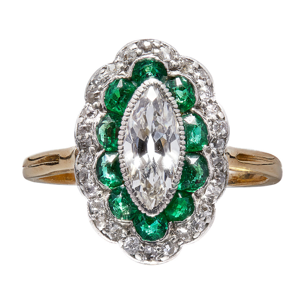 An emerald and diamond set ring
