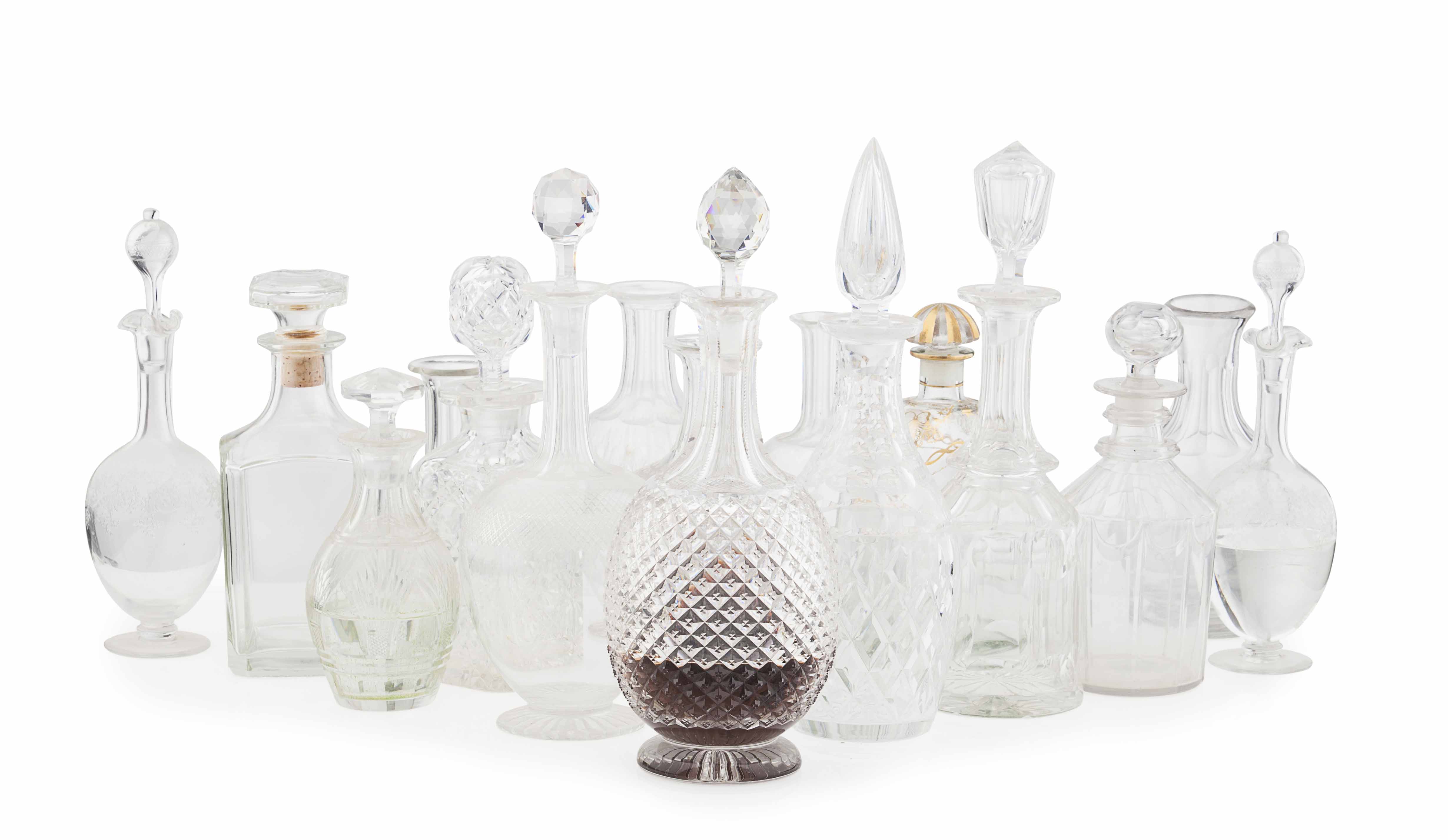 GROUP OF CUT AND ETCHED GLASS DECANTERS