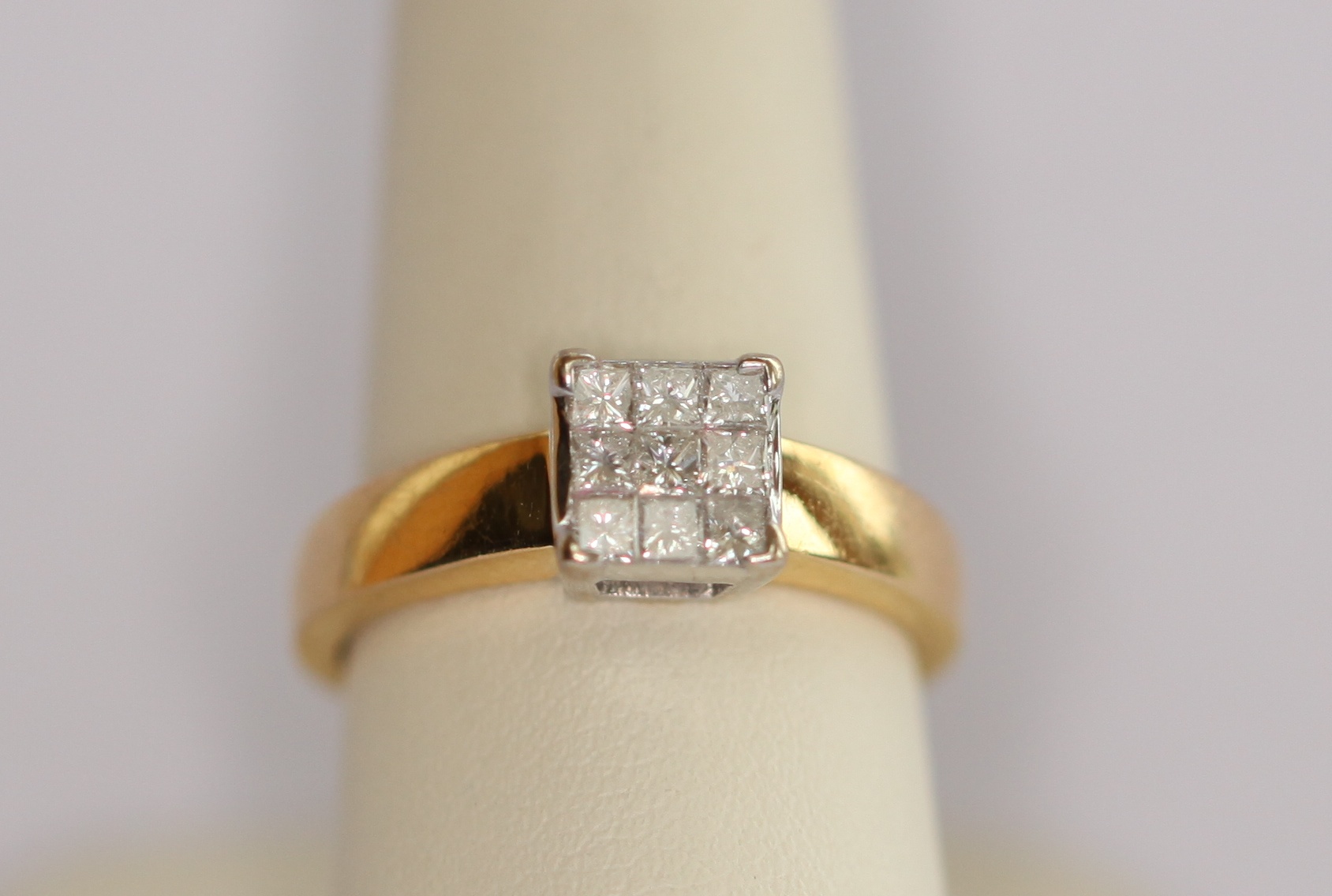An 18ct gold mounted diamond cluster ring