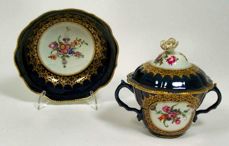 A Worcester twin-handled cup and saucer, circa 1755-1775
