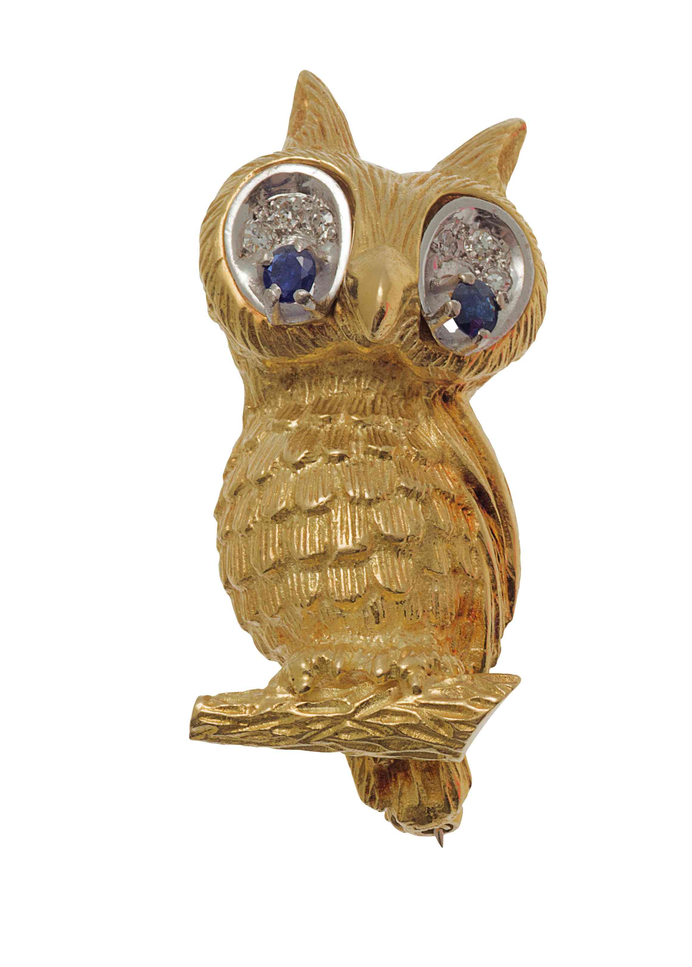An 18ct two colour gold, diamond and sapphire set humorous owl brooch