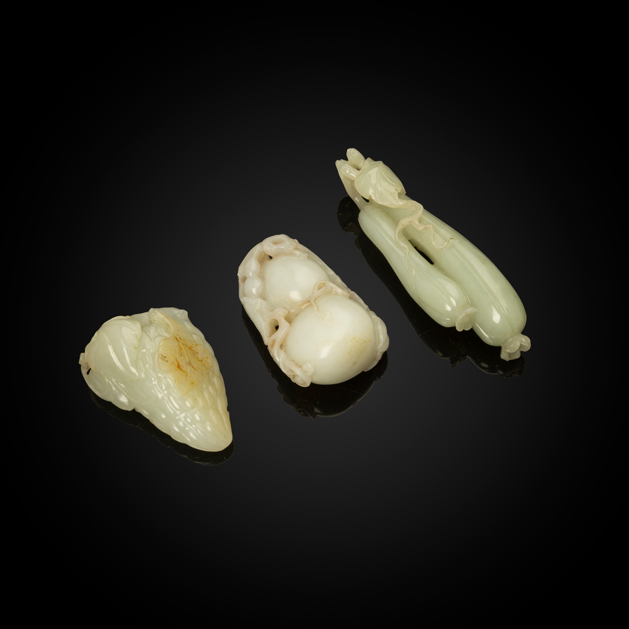 GROUP OF THREE JADE PENDANTS