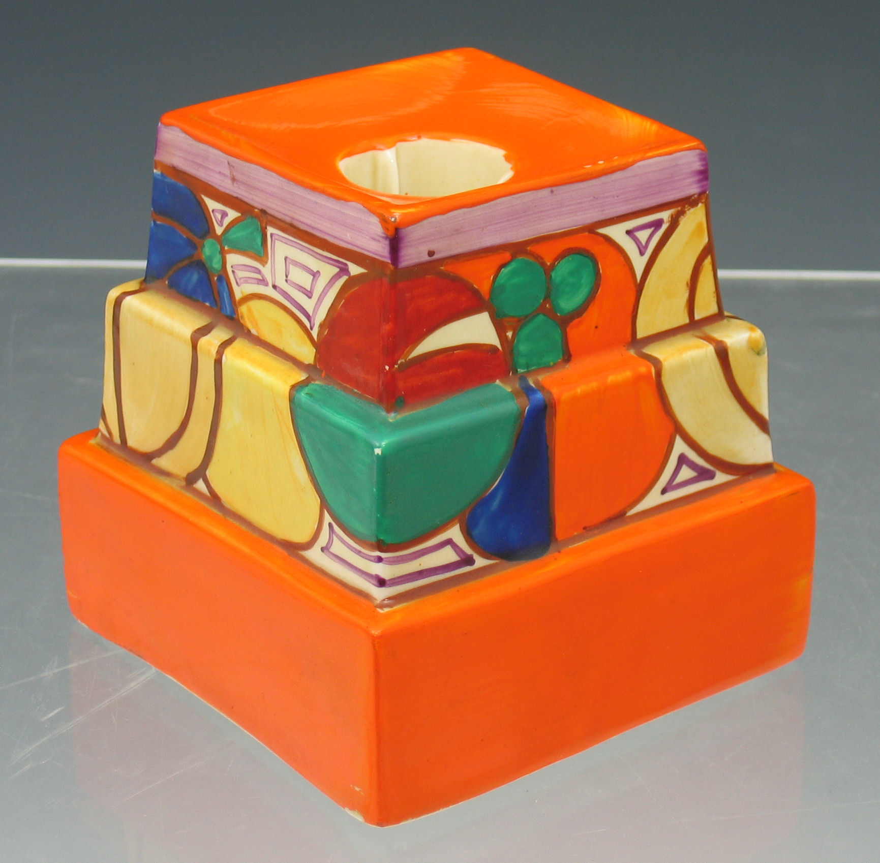 A Clarice Cliff stepped candlestick,