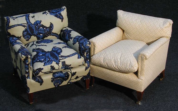 A pair of upholstered armchairs,