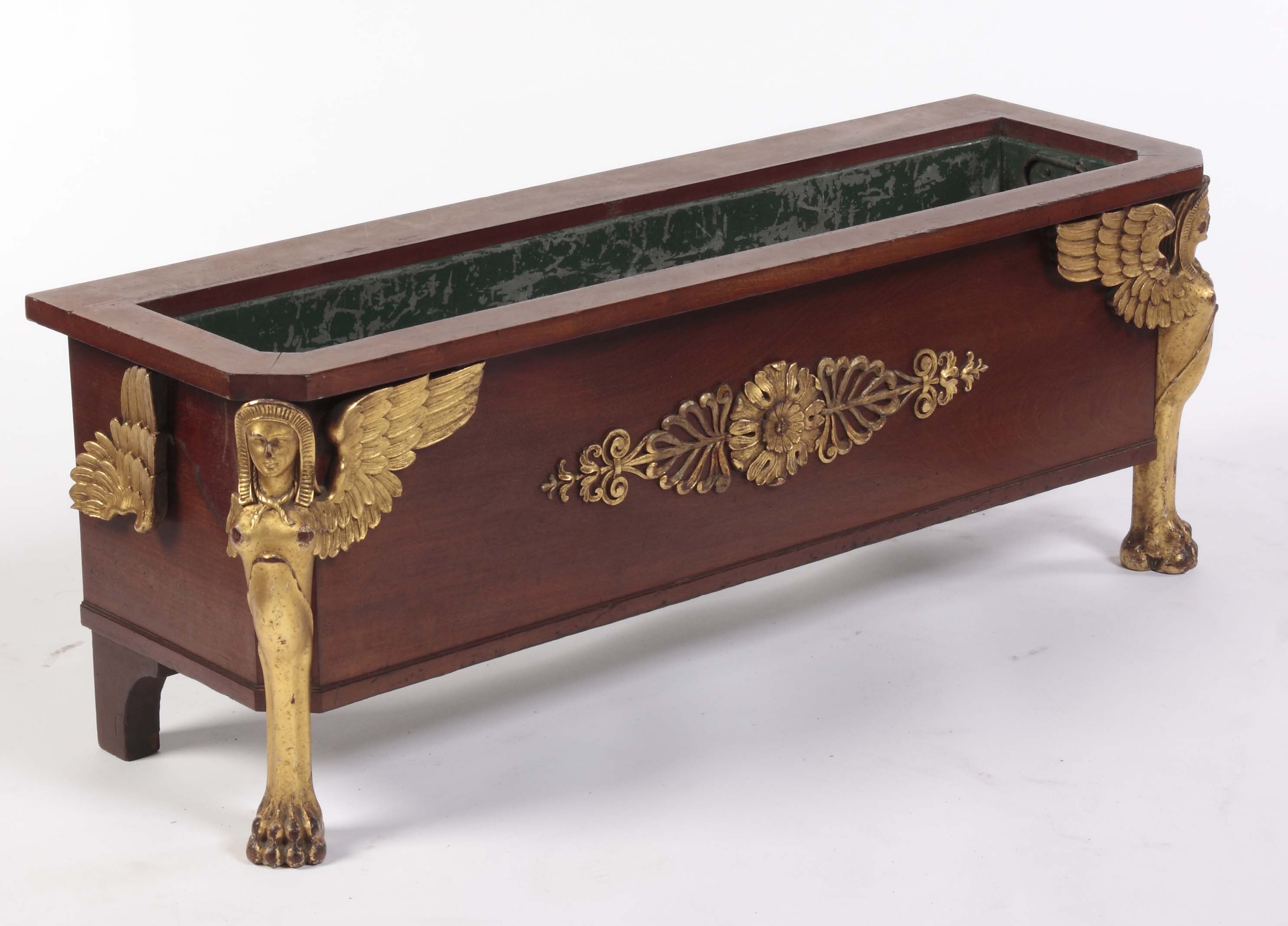 A mahogany and parcel gilt jardiniere In the Empire manner