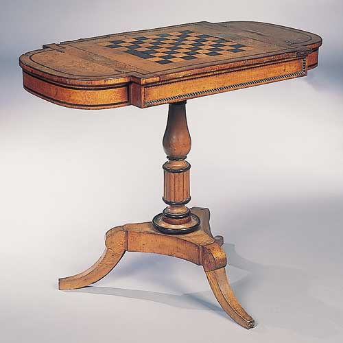 A Regency snakewood games table