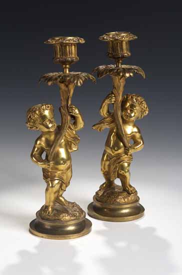 A pair of 19th century gilt brass candlesticks