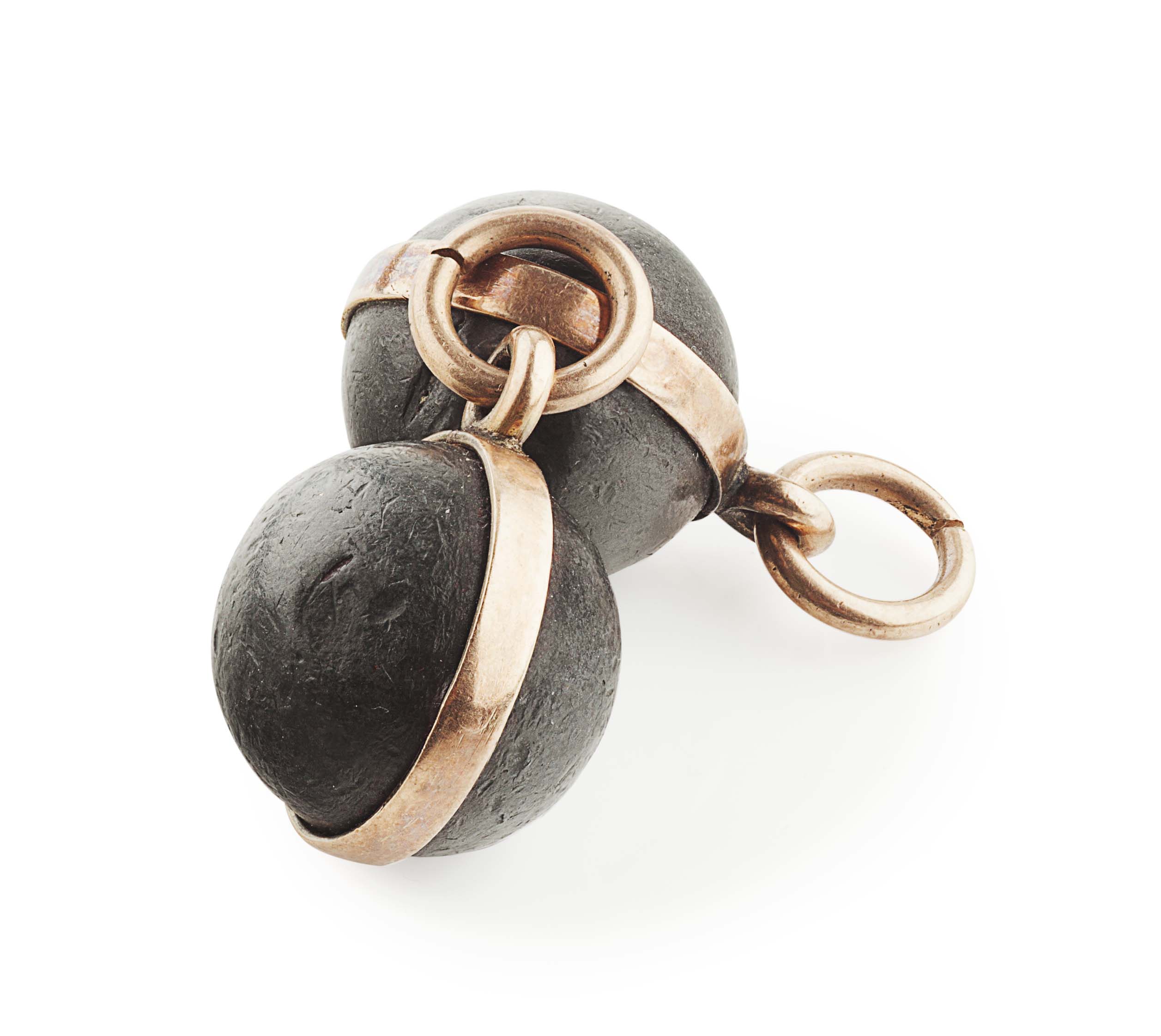 A pair of gold mounted musket balls