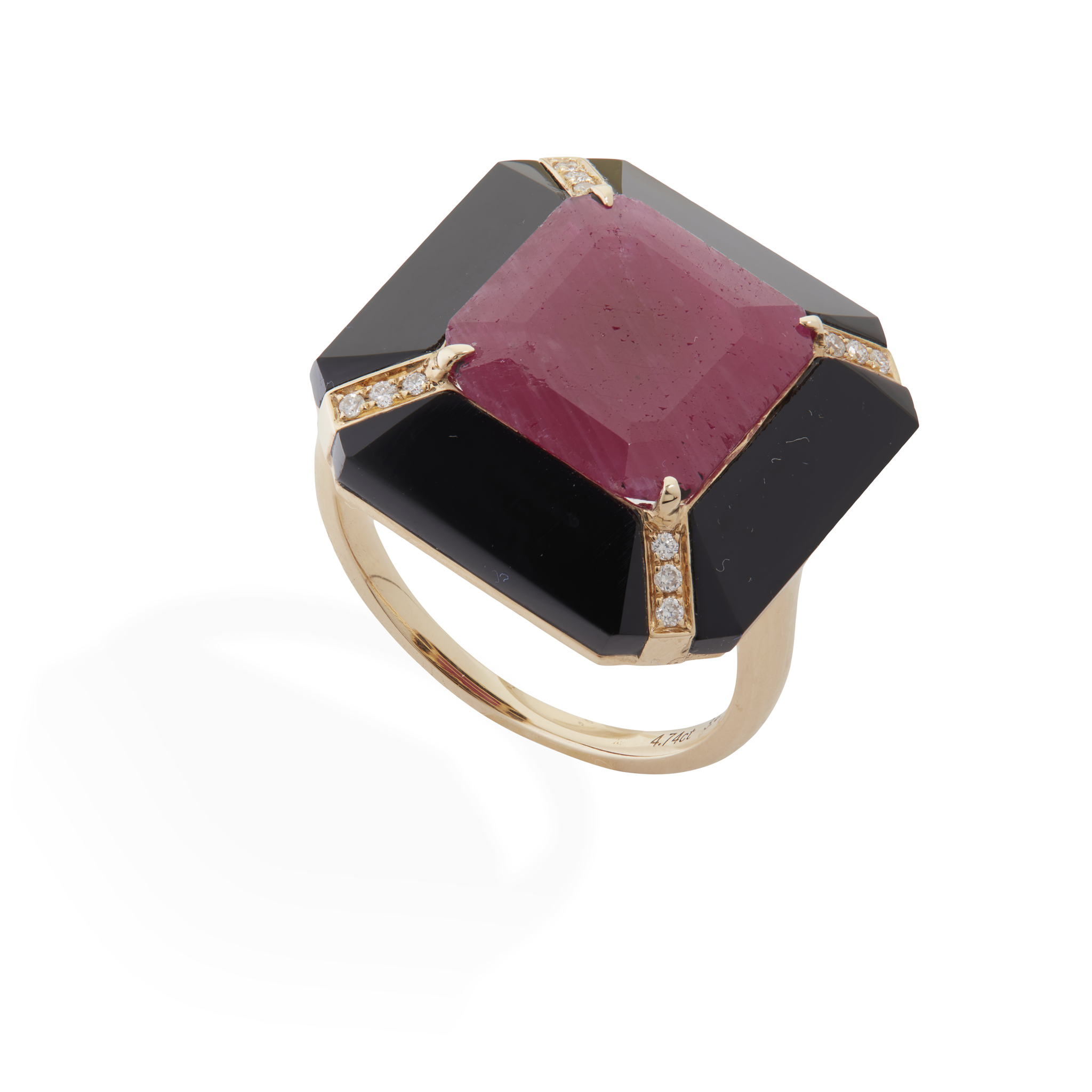 A ruby, onyx and diamond cluster ring