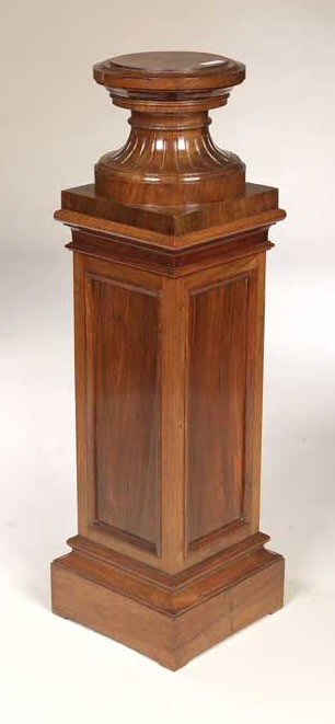 An Edwardian walnut pedestal,