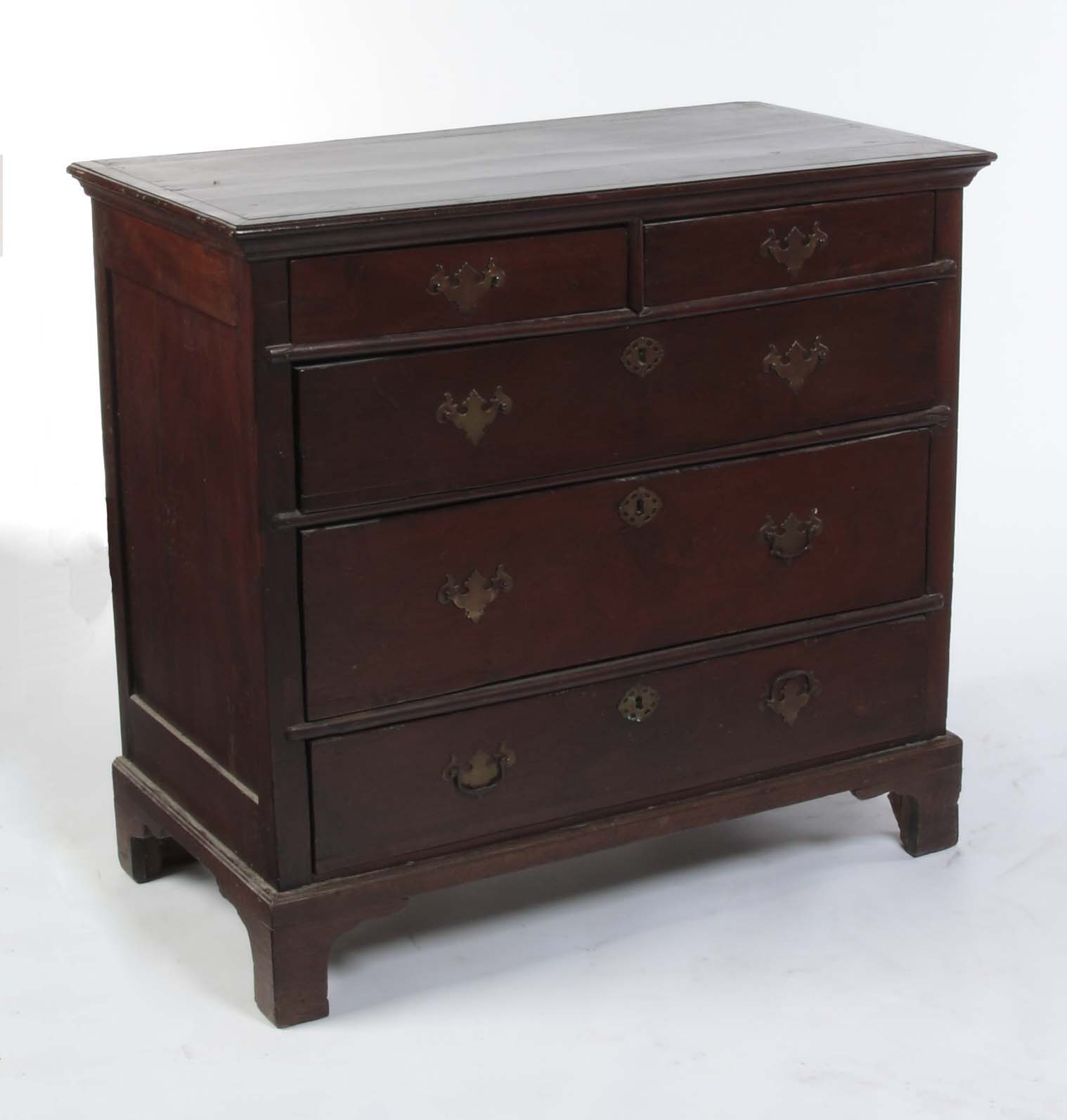An early 18th century yew-wood chest of drawers