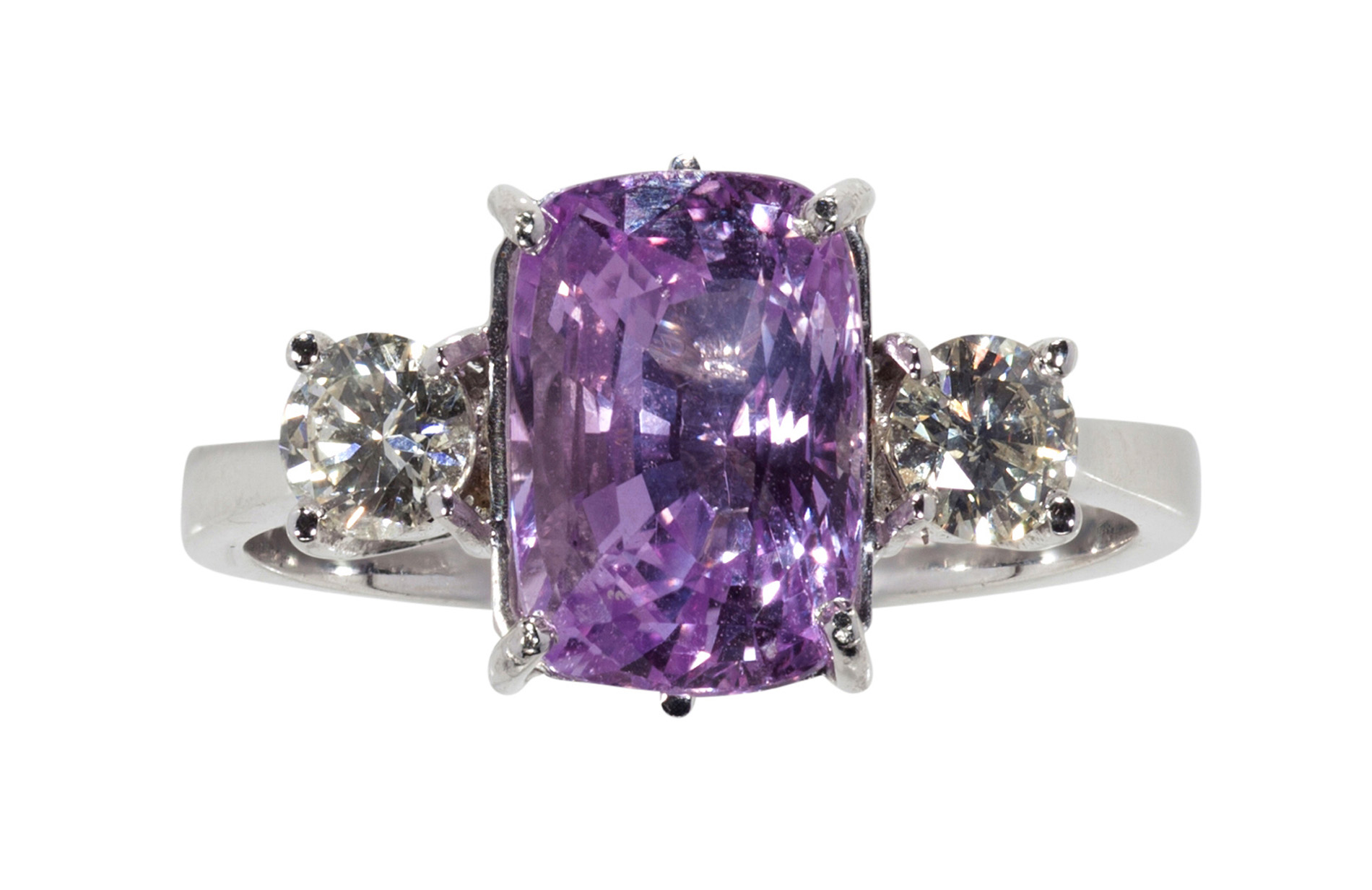 A pink sapphire and diamond set ring