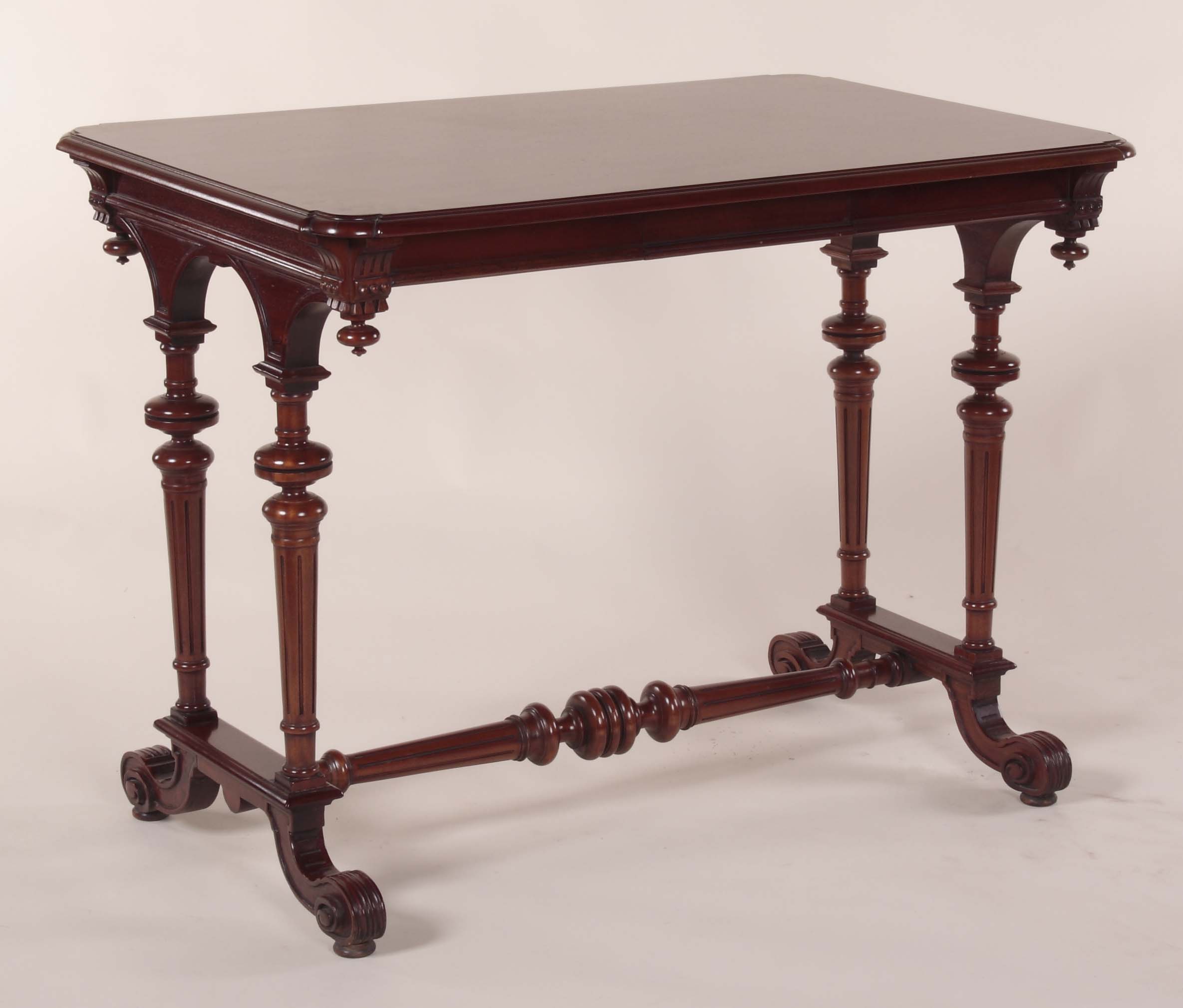 A late 20th Victorian style mahogany Gothic revival stretcher table