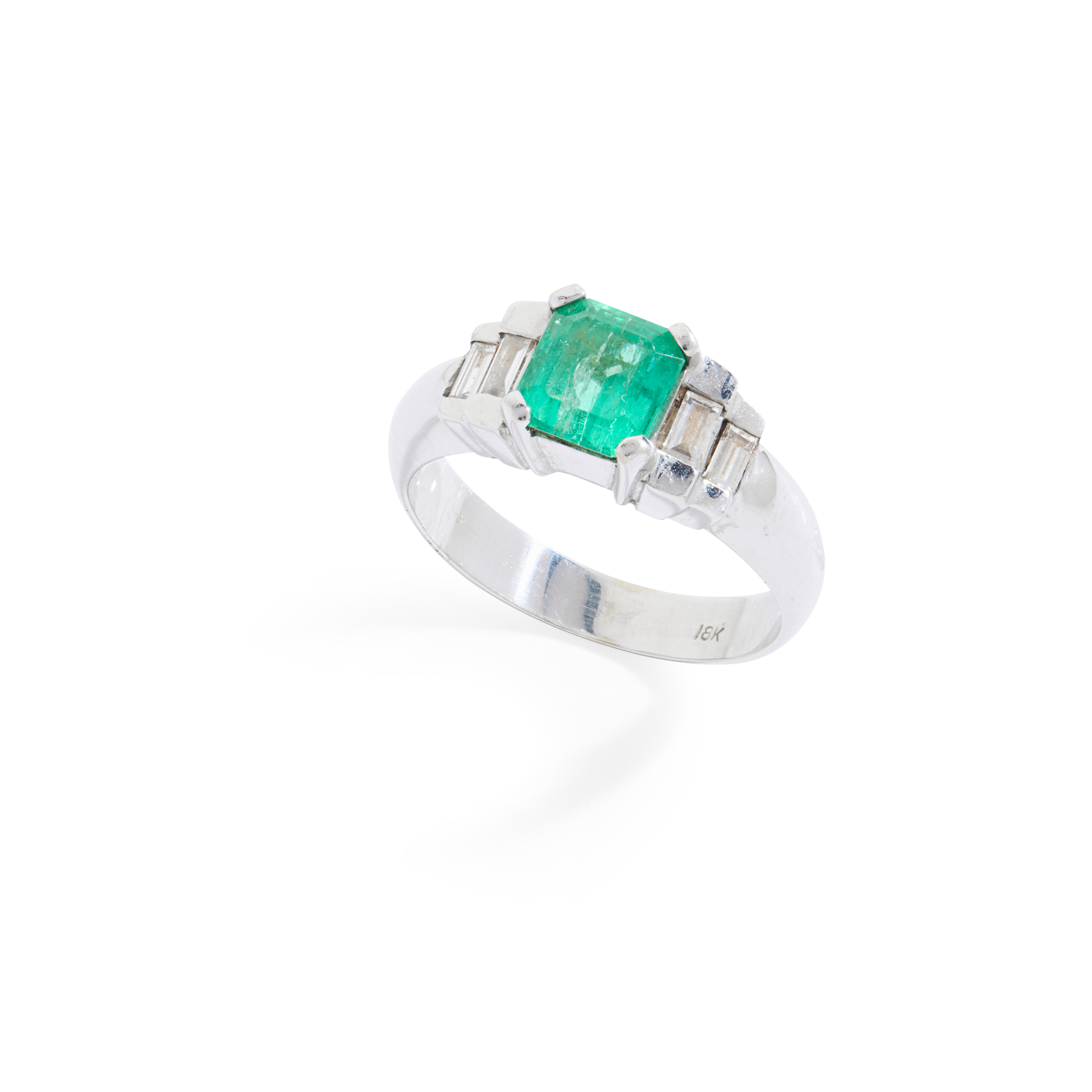 An emerald and diamond ring